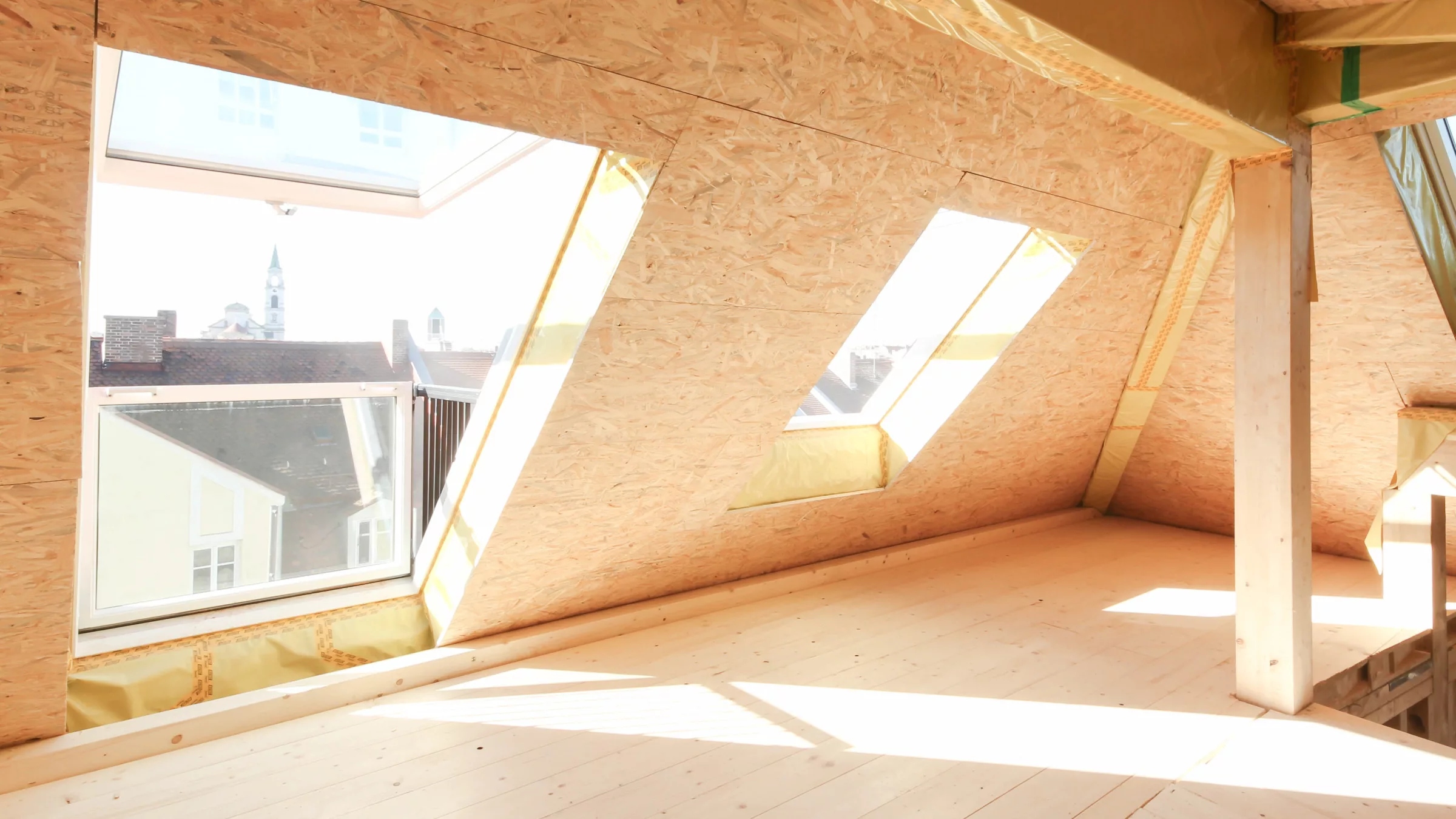 Daschgeschosswohnung Neubauprojekt in München mit Holzboden