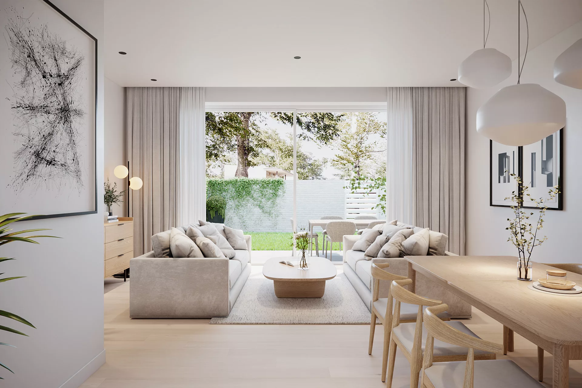 Hochwertige Immobilie: Blick in das große,helle Wohnzimmer mit zwei Sofas, Couchtisch, Esstisch und Gemälden und Zugang zum Garten