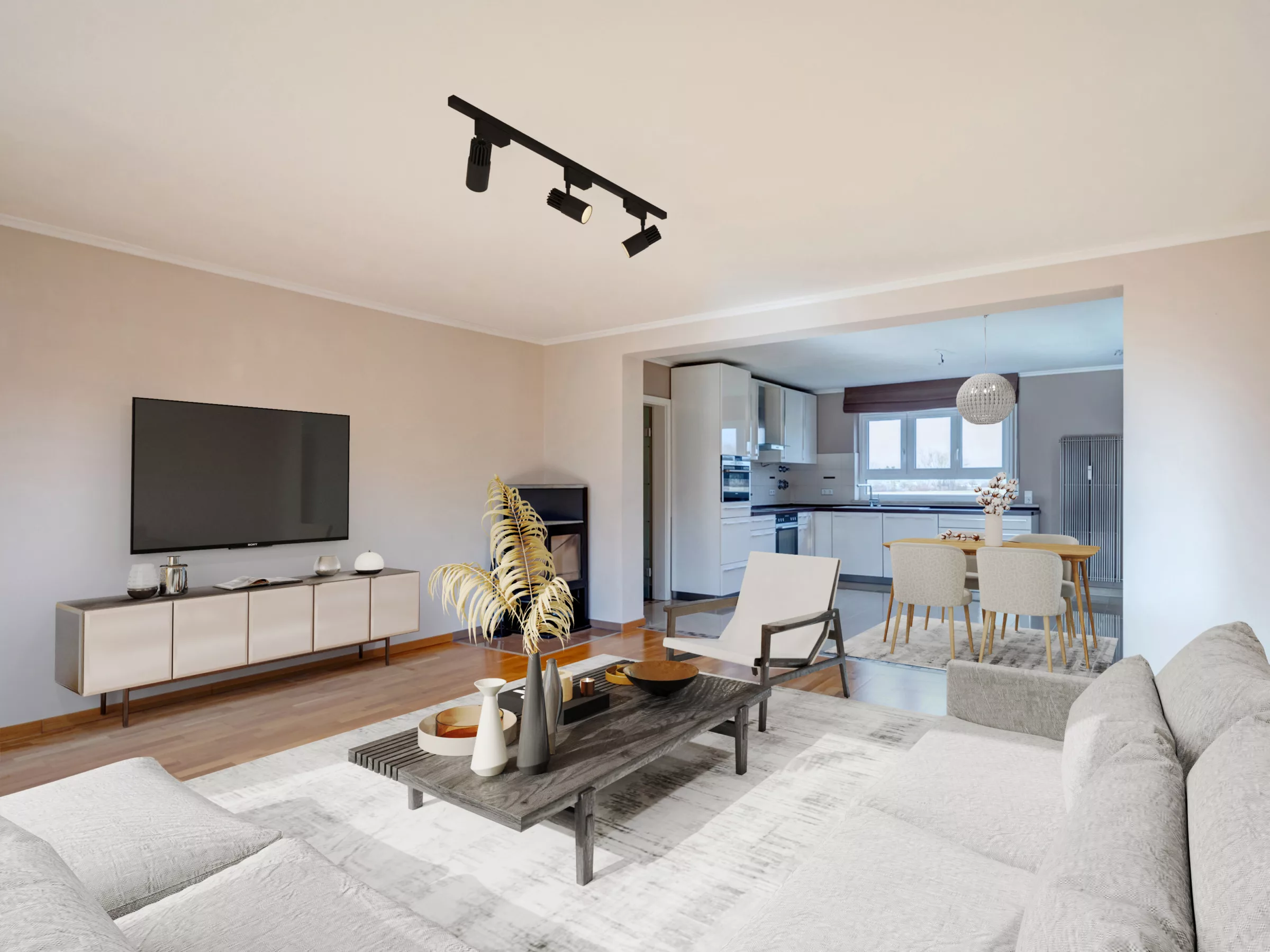 Modern eingerichtetes Wohnzimmer mit Blick in die Küche